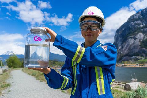 An image showing a Carbon Engineering staff member holding CE's synthetic fuel