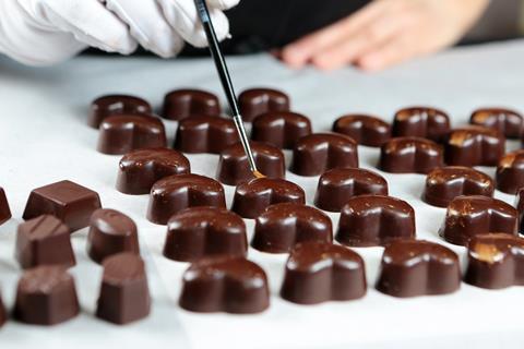 Chocolatier hand painting chocolate