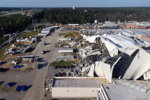 A modern industrial plant that has been ripped open by high winds