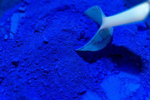 Scoop of ultramarine blue color pigments 