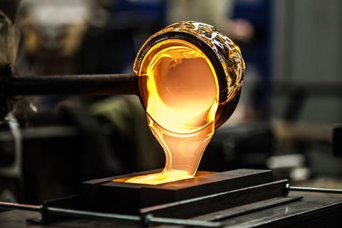 Pouring Melted Glass into Graphite Mold in Workshop