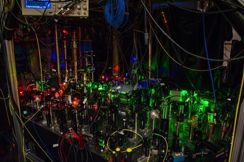 Slowing lasers in the foreground and the magneto-optical trap chamber in the background
