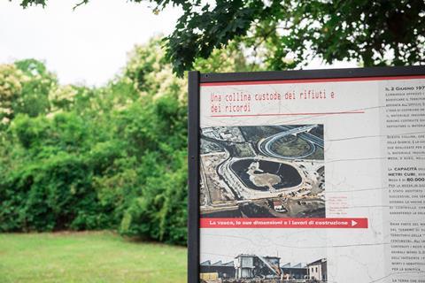 Seveso park information board with trees in the background