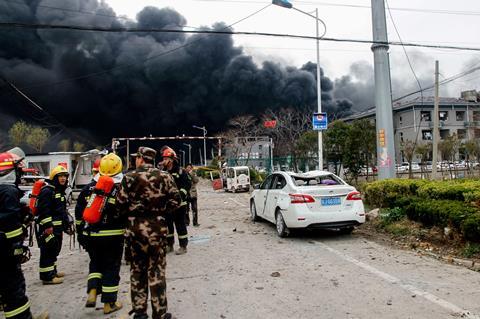 An image showing firemen and Chinese paramilitary police officers at an explosion site in Yancheng