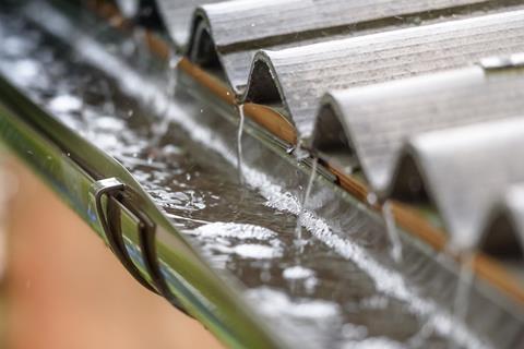 An image showing rain flowing from a roof