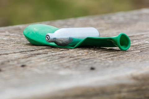 Balloon and nitrous oxide canister after use.