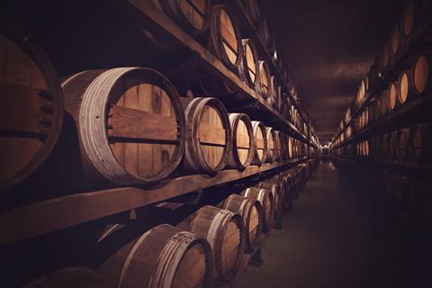 Wine cellar with a row of barrels, Austria