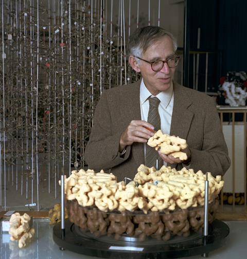 Aaron Klug photographed in the model room at LMB with one of his virus models, c. 1970s.