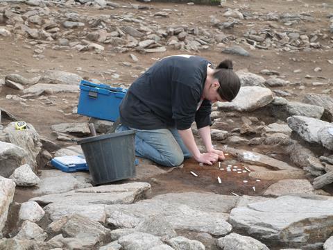 An image showing the process of taking archaeomagnetic samples from a hearth
