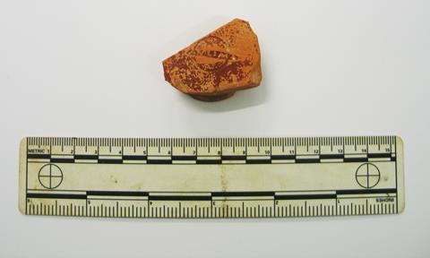 An image showing a fragment of samian ware terra sigillata showing the stamp which identifies the maker as Paullus IV of Lezoux