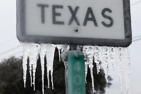 An image showing a frozen Texas sign