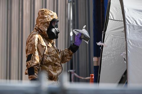 A photograph of an army officer during a search of a city centre hostel in Salisbury, UK