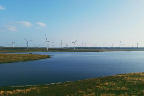 An image showing windmills next to water