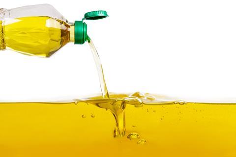 Bottle of vegetable oil pouring out