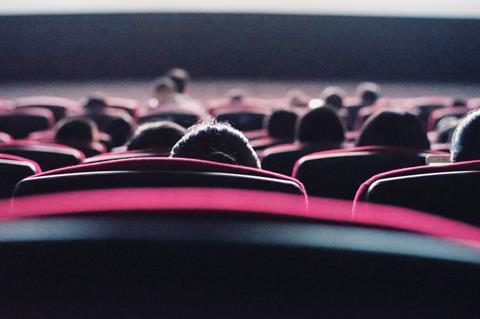 A photo of people at the cinema