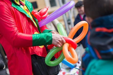 Clown making a rubber balloon