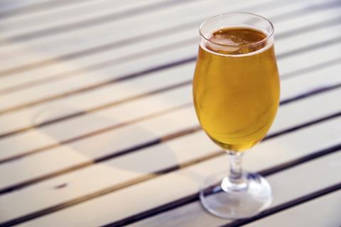 Pint of beer on a wooden table