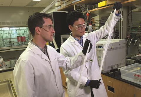 ryan lively and dong yeun koh holding polymer fibers