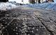 An icy footpath that has been gritted with rock salt