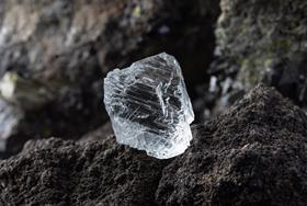 Electron irradiation converts hydrocarbon crystals into nanodiamonds