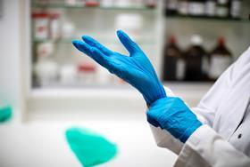 Lab glove deposits drive false microplastic signatures in atmospheric pollution samples